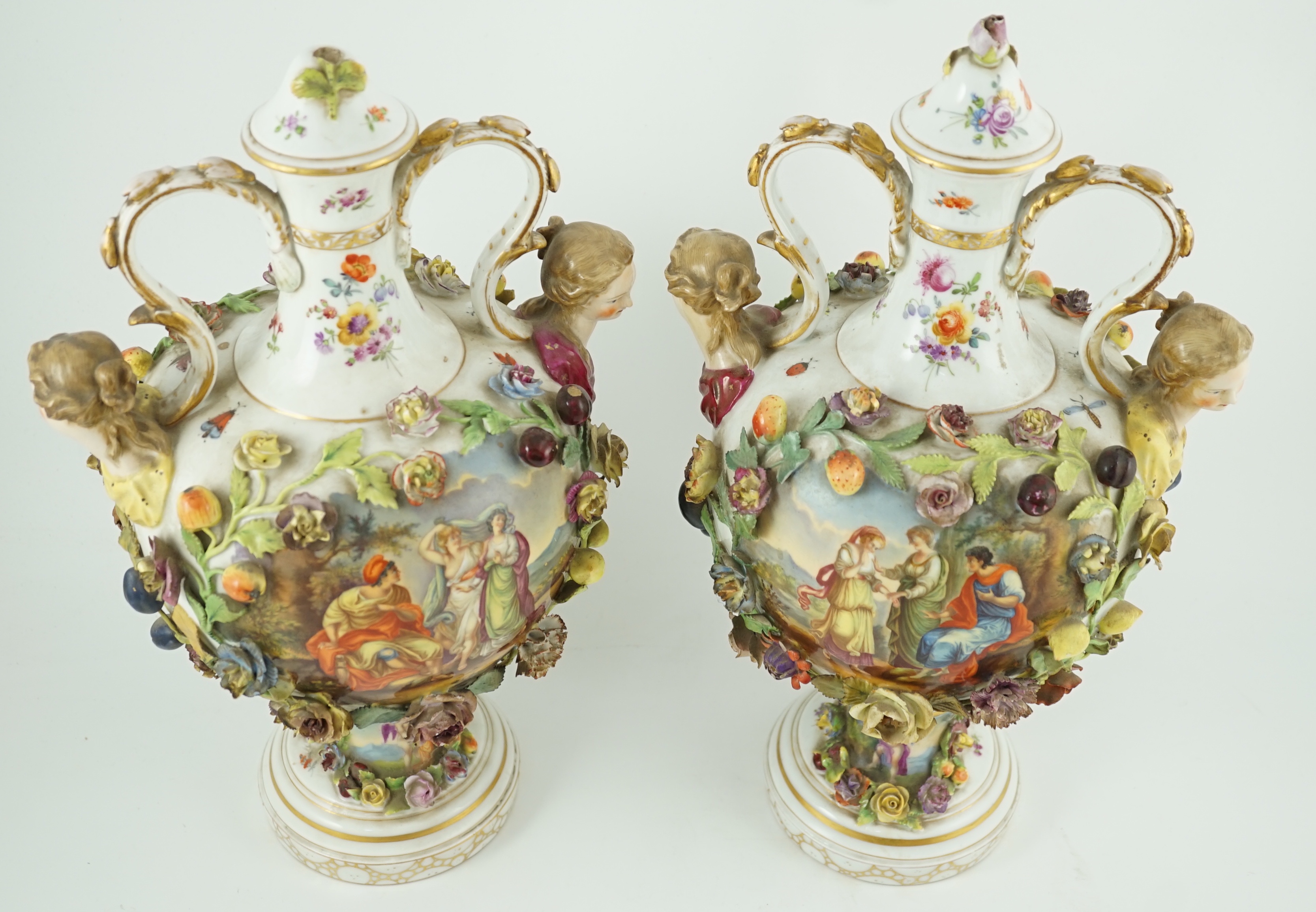 A pair of Potschappel porcelain vases and cover, late 19th century, 41cm high, slight damage